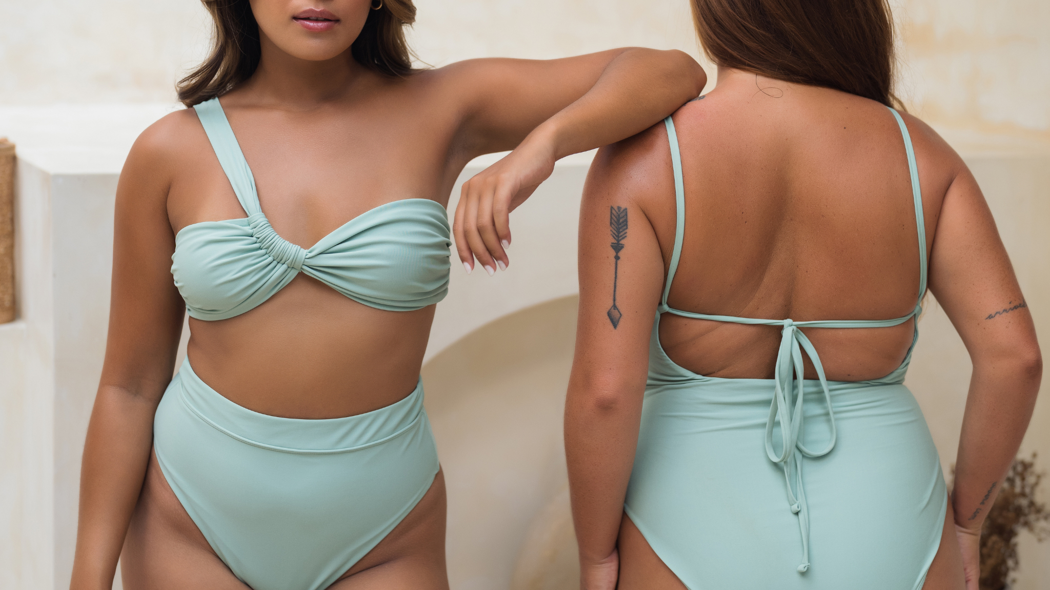 two women wearing pinksalt swimwear's timeless swimsuits side by side