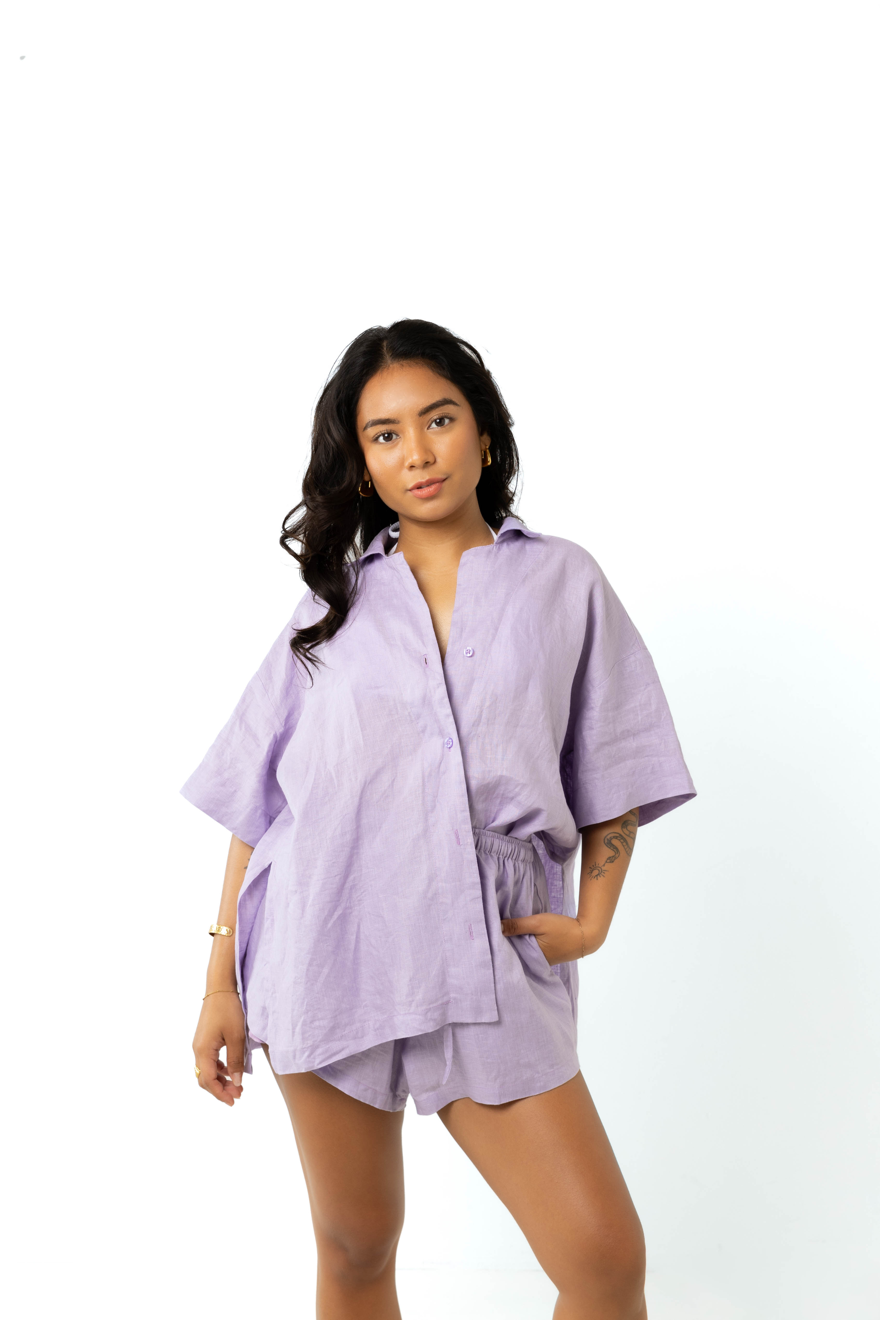 model wears size 6/8 linen shirt and shorts set in lilac
