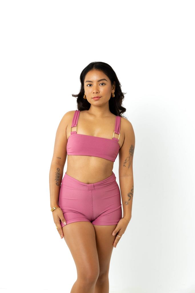 size 6 model wears yasmeen spice pink bikini crop top and campbell high-waisted swim short, standing in studio with white background facing front to camera