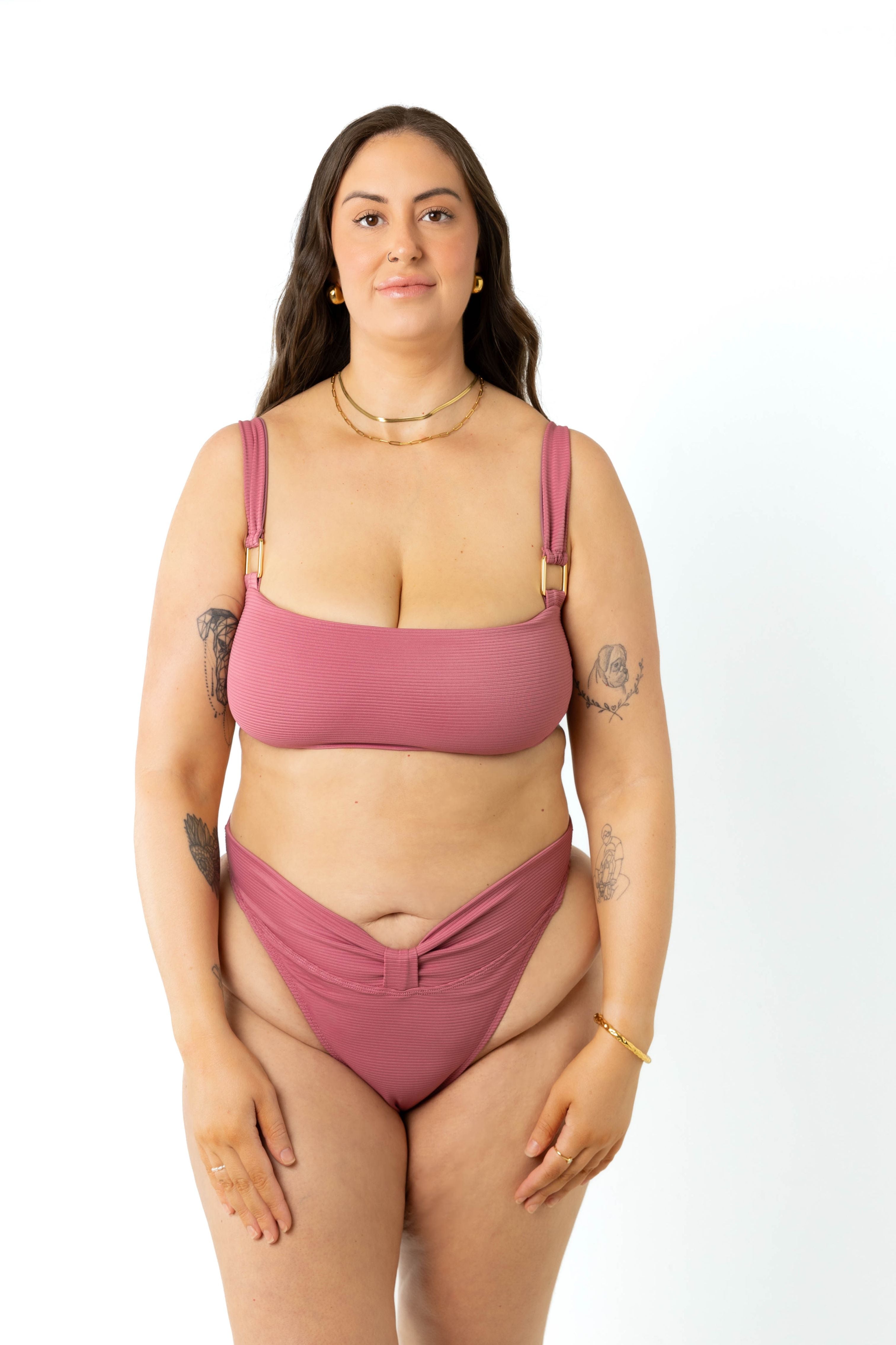 size 18 model wearing the yasmeen bikini crop top and high-cut leg bikini bottoms in colour spice pink, front view.
