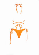 Close up back view of women's orange triangle string bikini.